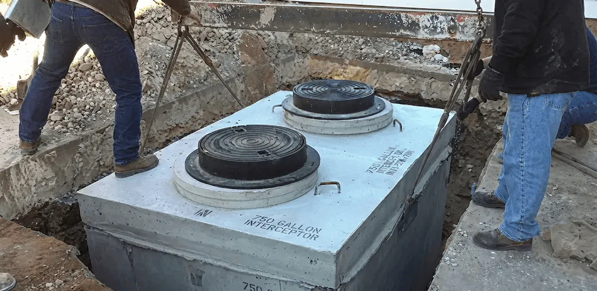 Grease trap installation for a commercial property drainage system in Indianapolis, IN