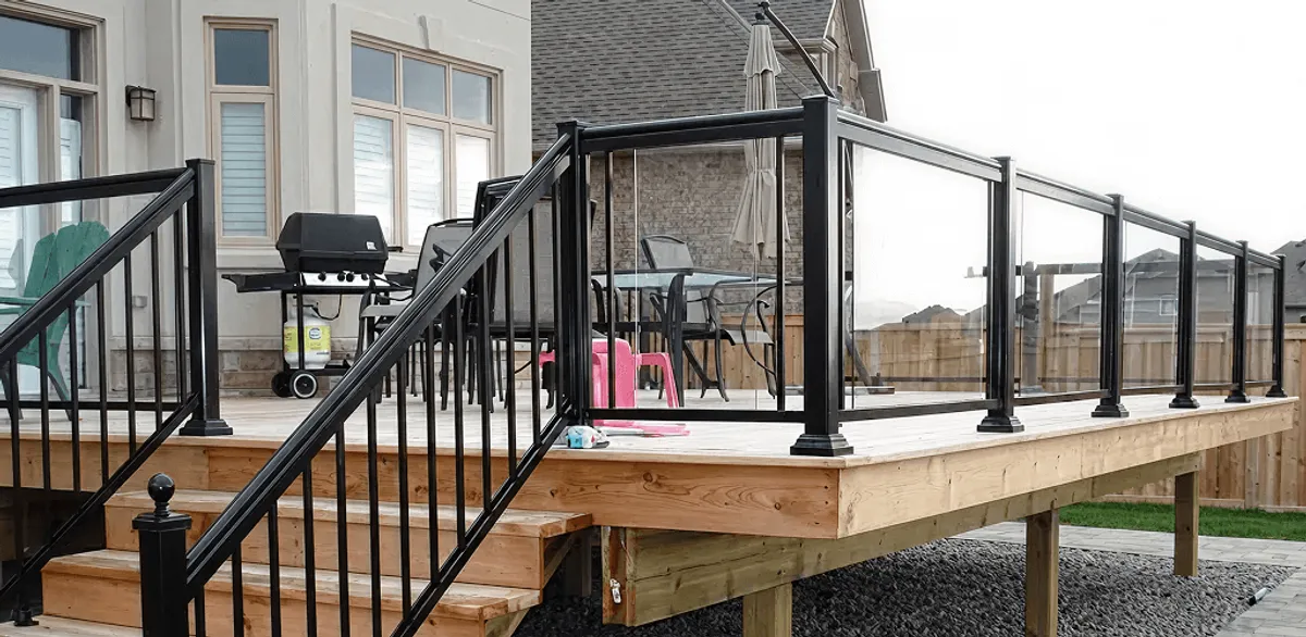 Handrail installation on a deck staircase for safety and code compliance in Indianapolis, IN